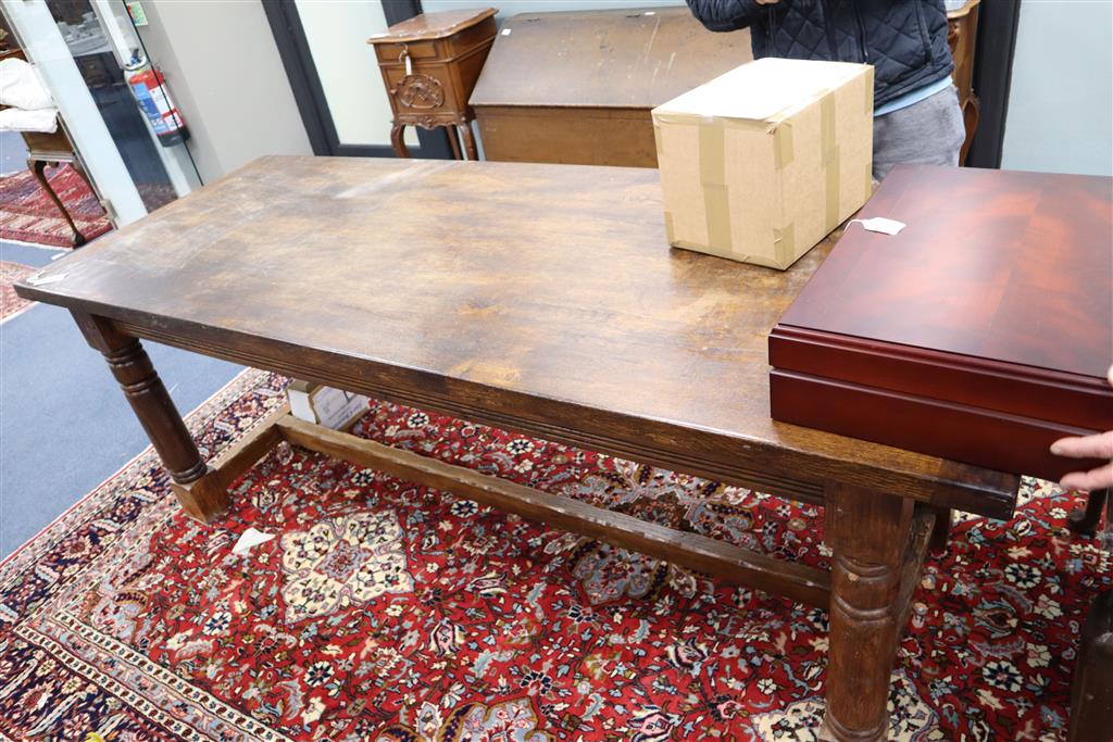 An 18th century style oak refectory dining table, width 211cm, depth 83cm, height 75cm